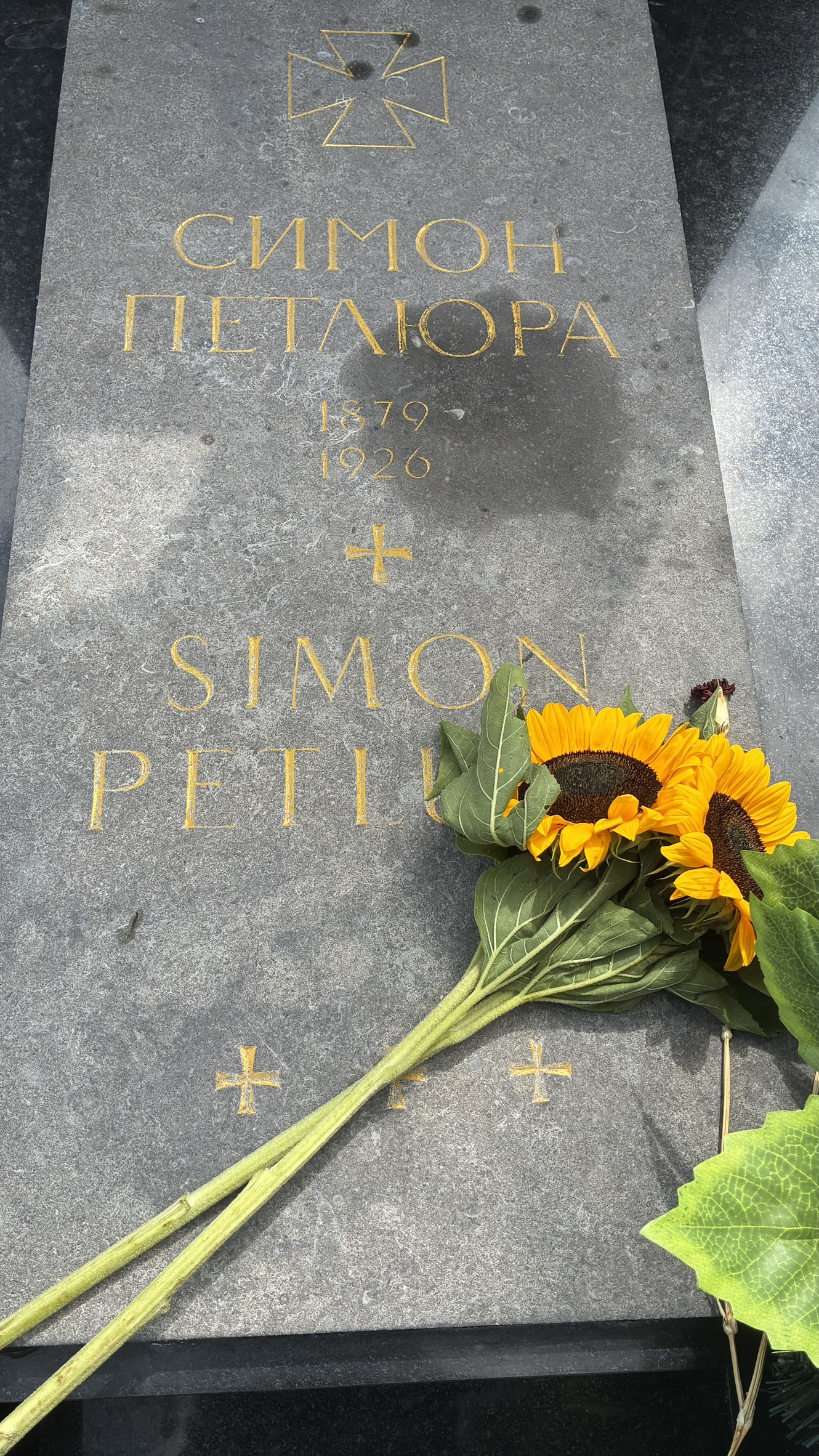 Grave of Symon Petliura with sunflowers at Montparnasse Cemetery